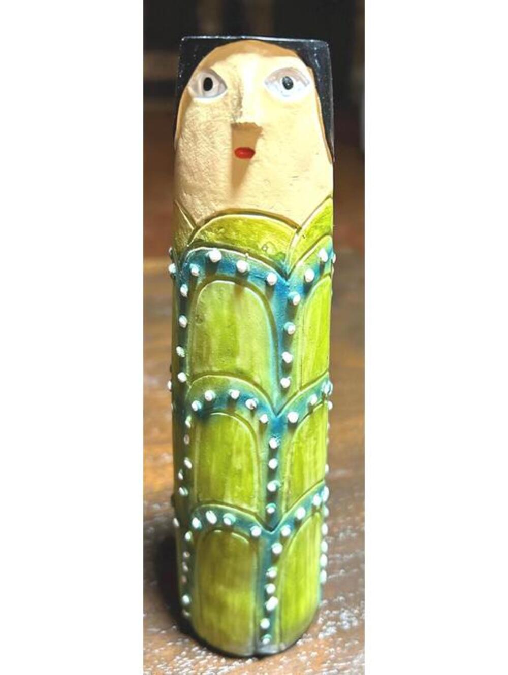Folk art asparagus bud vase made in Mexico from resin.